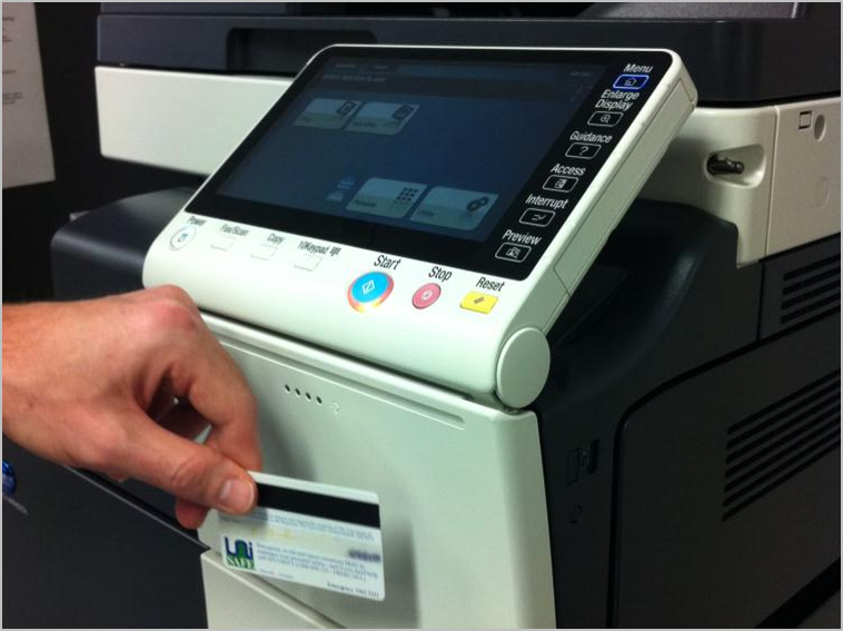The card scanner is just below the printer touch screen.