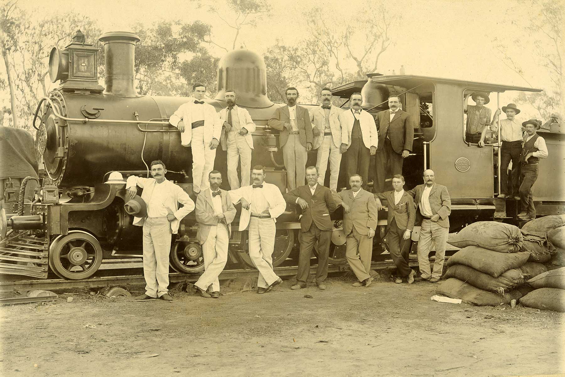 Chillagoe officers standing on and in front of a train, Chillagoe Railway Line, Queensland, c.1900-1901