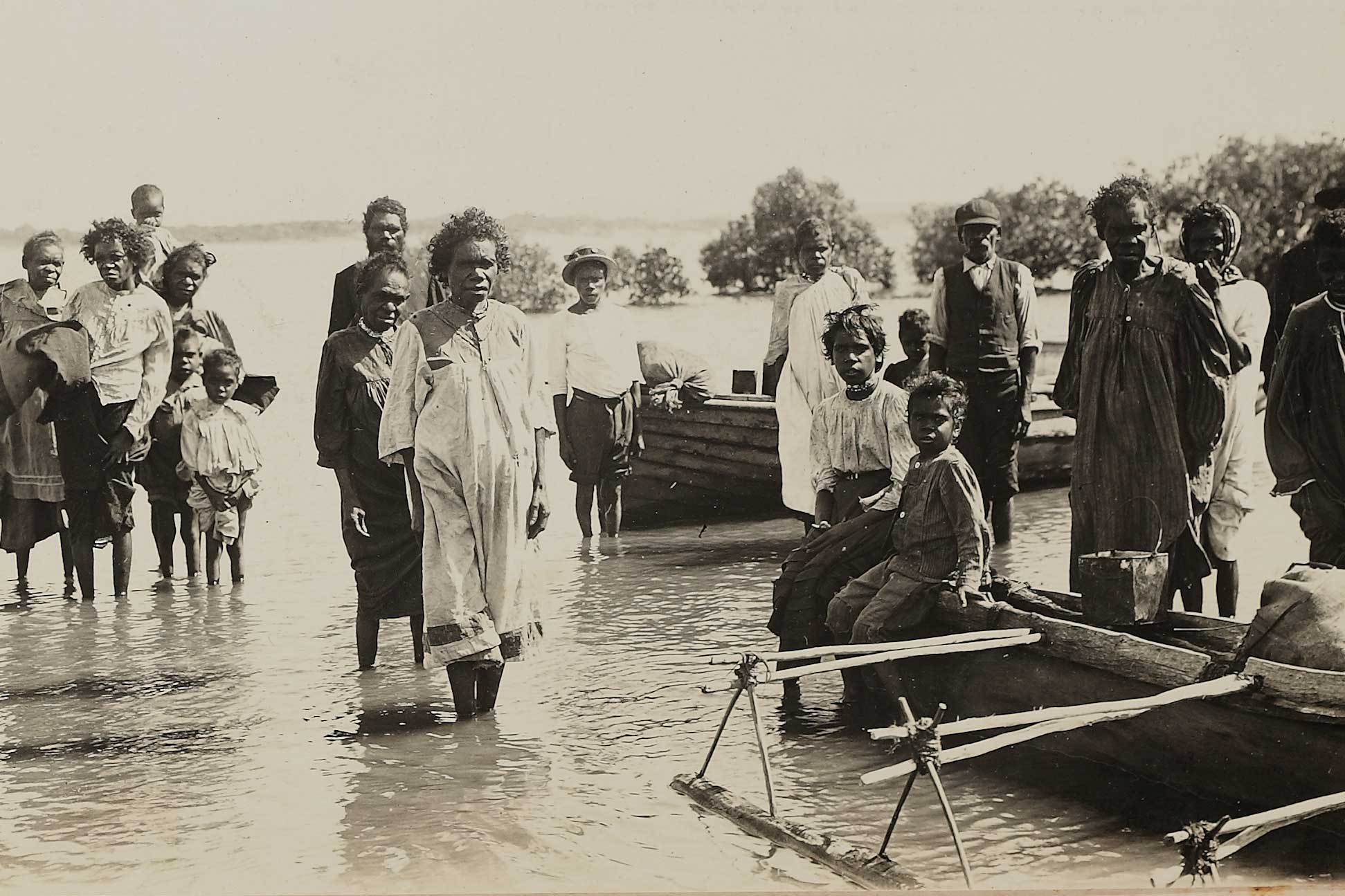 Group of people in canoes at Cooktown; Children at Cooktown; Group arriving at Cooktown from their camp
