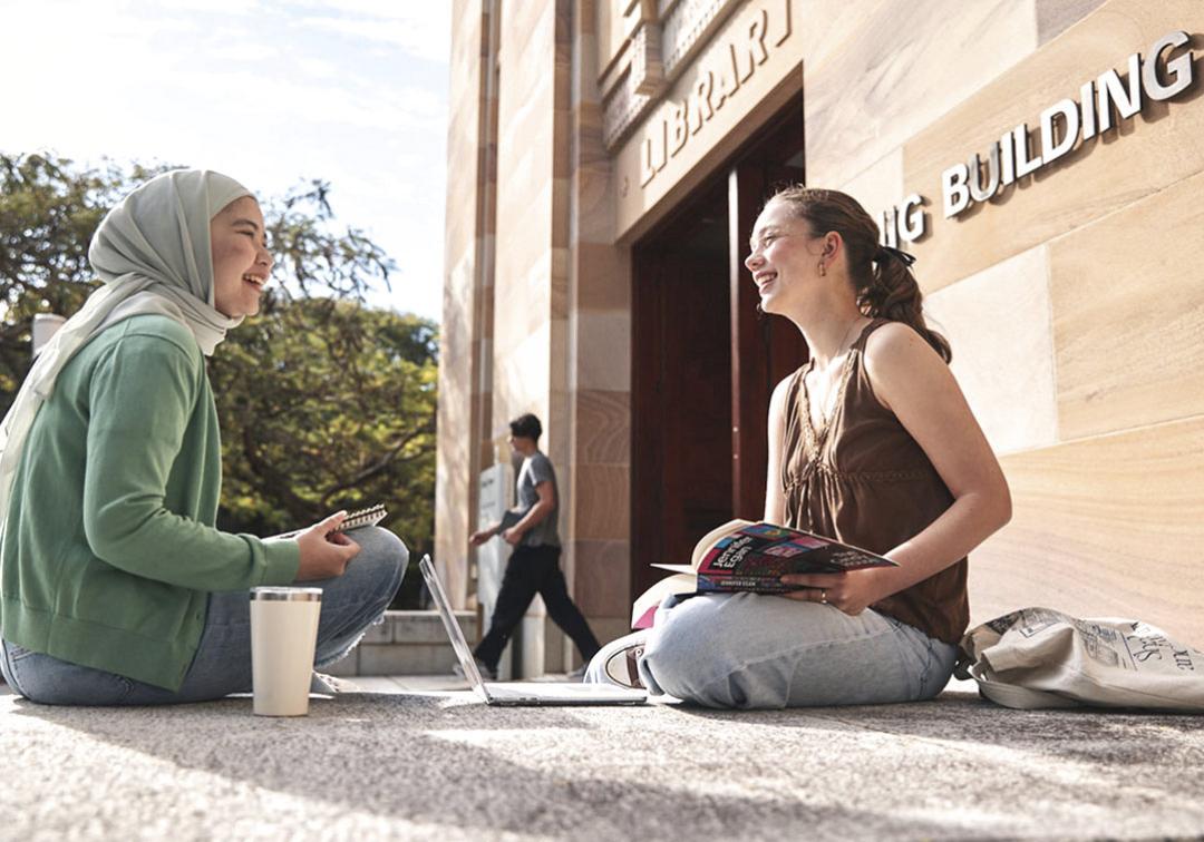 students in front of duhig tower