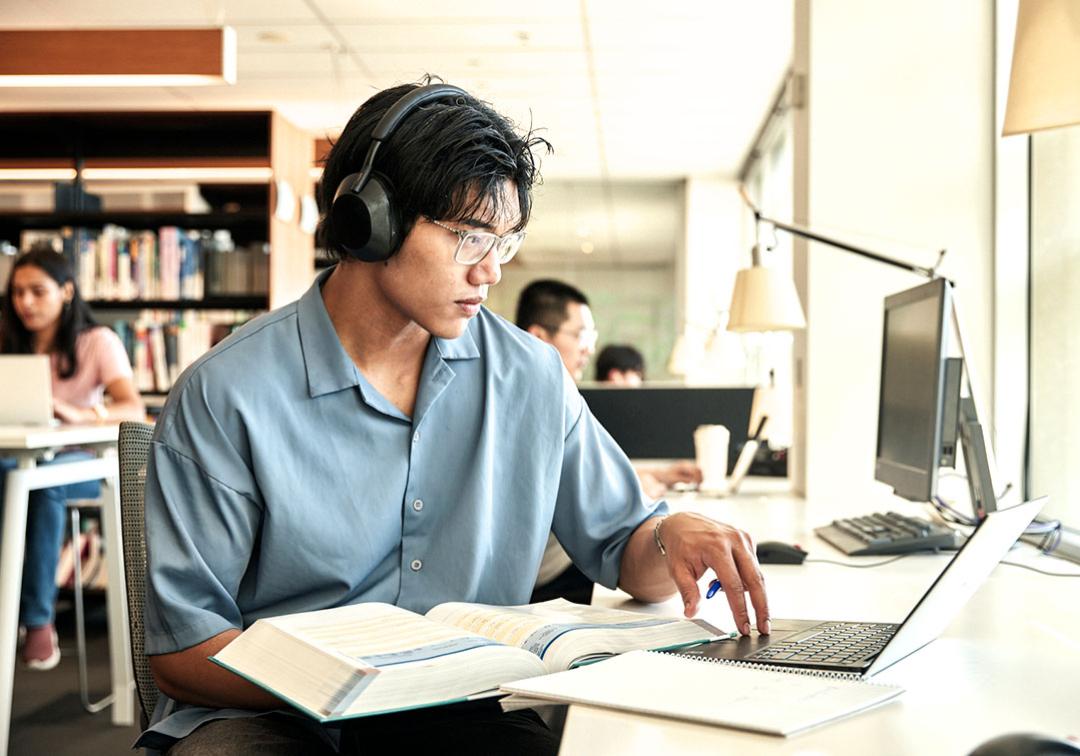 Student studying on a laptop.