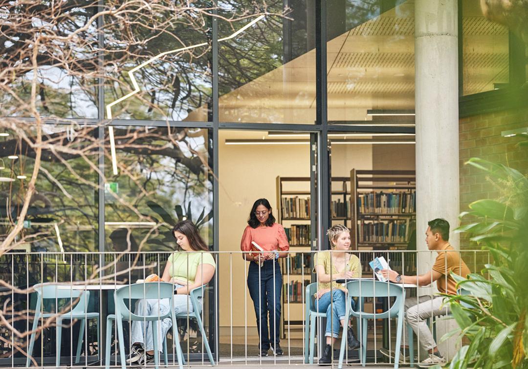 Student using outdoor seating on the terrace at JK Murray Library at UQ Gatton.