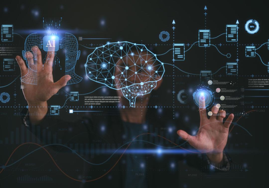 Man using touchscreen with lots of digital symbols.