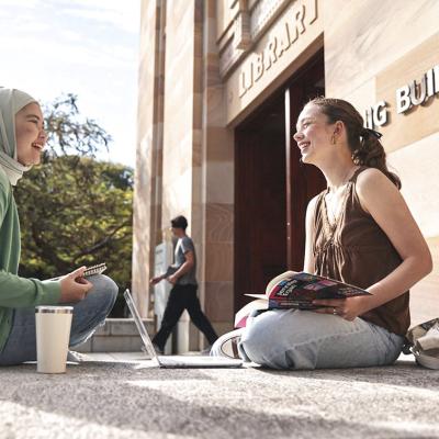 students in front of duhig tower