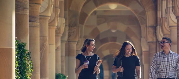 staff walking together in the Great Court