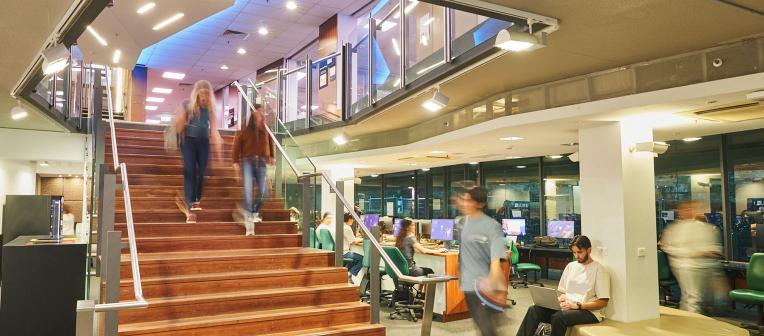 Students walking through Level 1, Biological Sciences Library.