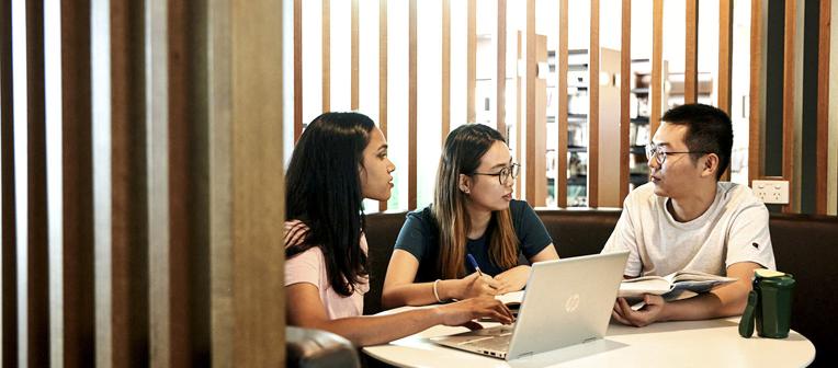 Students studying in a booth at Dutton Park Library.