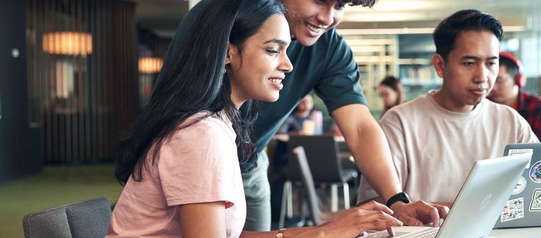 students using a laptop