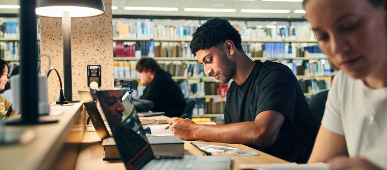 student studying in the library