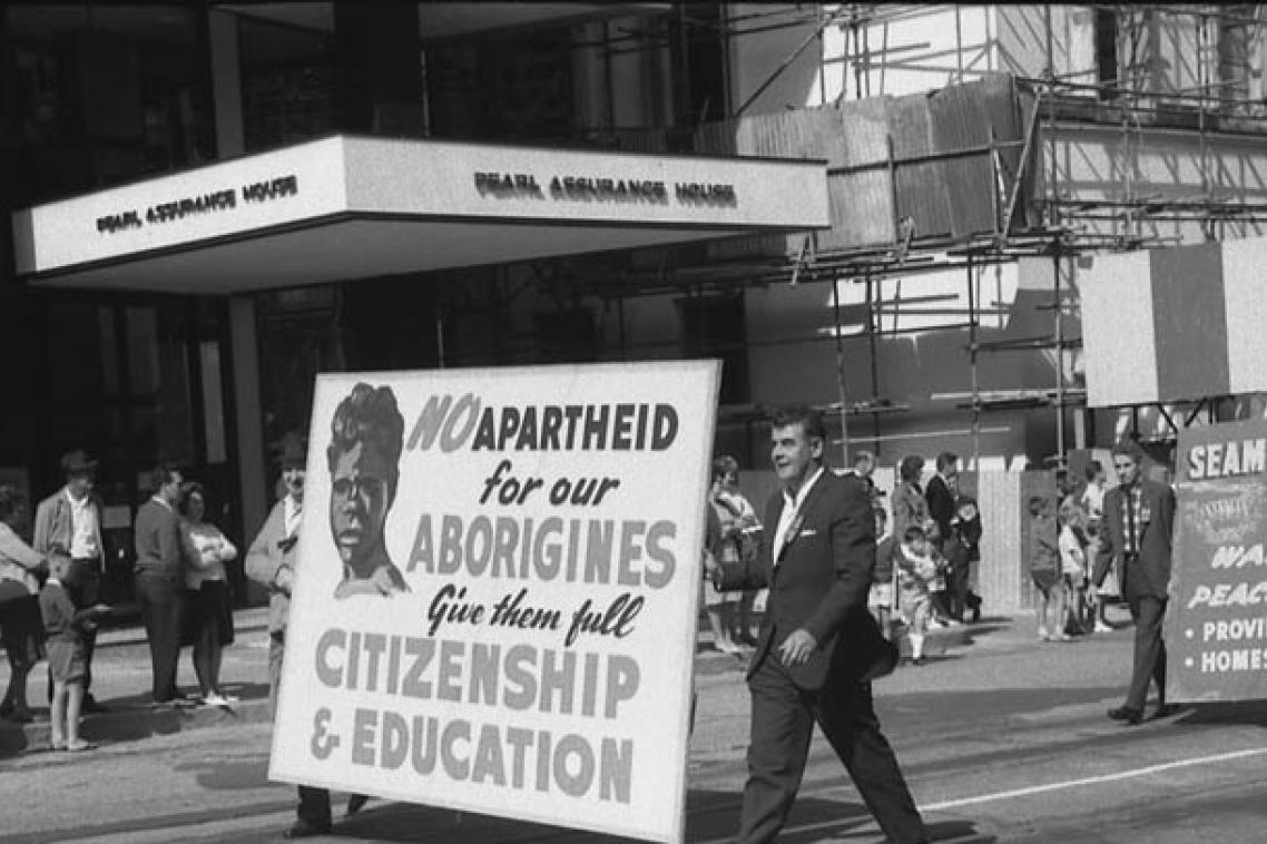 Protest march with sign saying No apartheid for our Aborigines. Give them full citizenship and education.