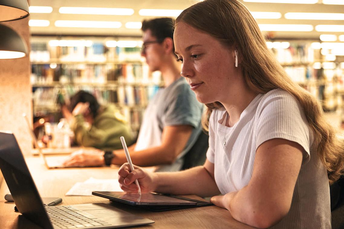 student looking at laptop