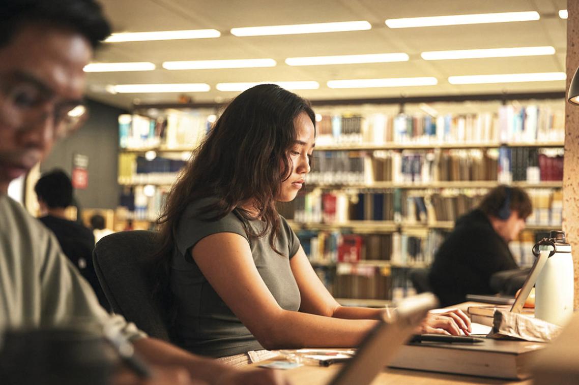 student studying in the library