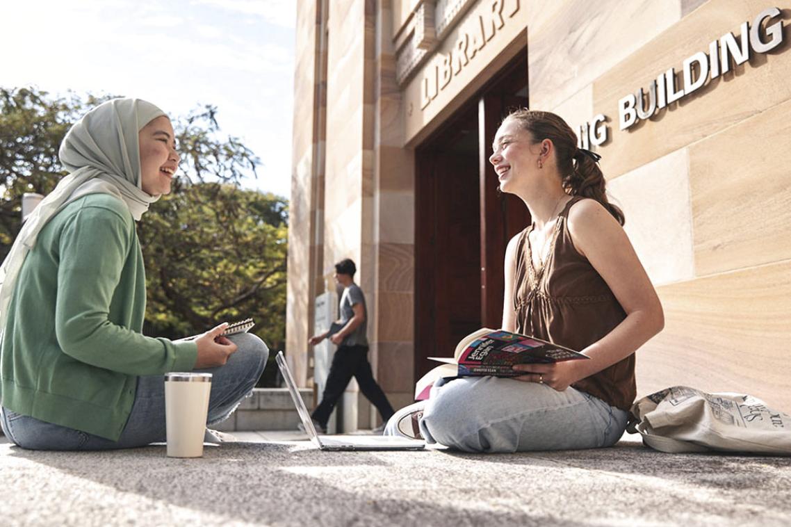 students in front of duhig tower