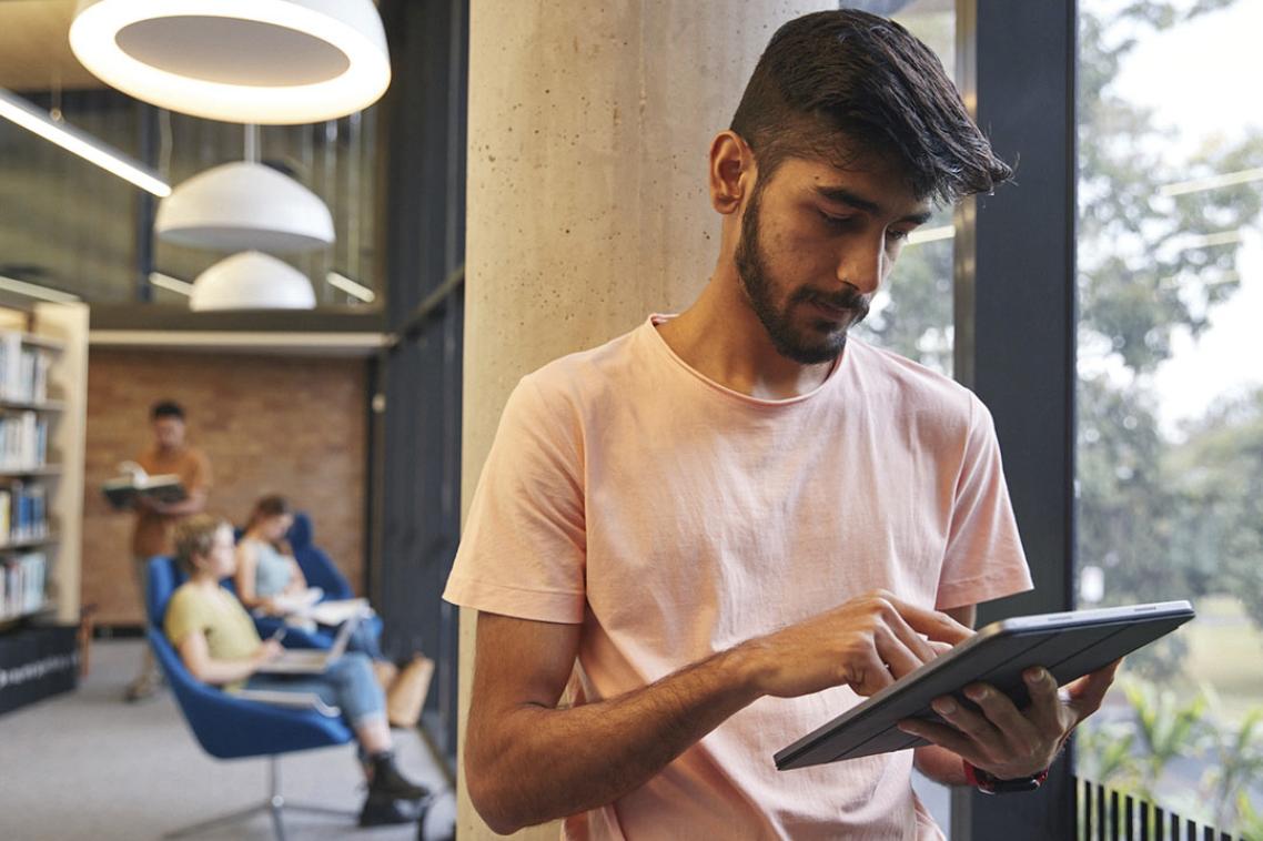 student with device