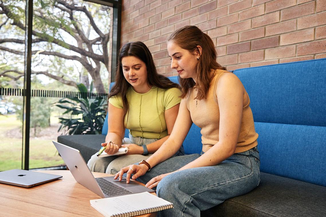 students looking at a laptop