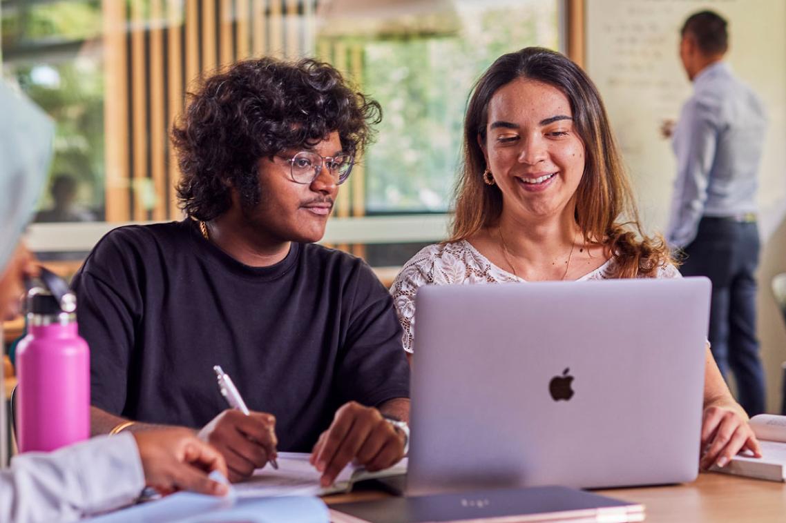 two students with laptop