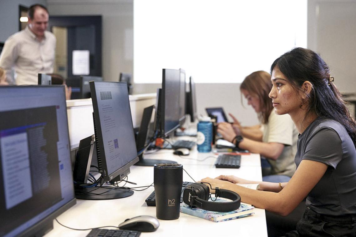 student using a library computer